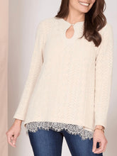 Load image into Gallery viewer, Oatmeal chevron knit long sleeve top with keyhole neckline and layered lace hem cami, paired with dark jeans - 1