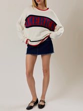 Load image into Gallery viewer, Oversized ivory knit America sweater with red and navy stripe graphic lettering, paired with denim mini skirt - 5