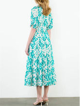 Load image into Gallery viewer, Tiered maxi dress in aqua and cream ikat print with tassel tie neckline and flutter sleeves - 5