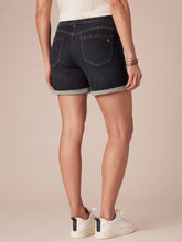 Load image into Gallery viewer, Women's dark wash denim midi shorts with cuffed hem and five-pocket style, paired with white sneakers - 2