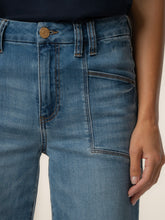 Load image into Gallery viewer, Meg High Rise Wide Leg Jeans in medium blue wash with patch pockets, paired with gray sneakers - 4