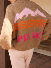 Load image into Gallery viewer, Camel chunky knit mock neck sweater with pink and orange mountain Apres Ski graphic design - 2
