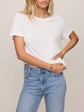 Load image into Gallery viewer, Woman wearing white Foundation Slub Tee with blue high-waist jeans, styled with gold bracelet and rings - 1