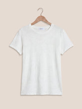 Load image into Gallery viewer, Woman wearing white Foundation Slub Tee with blue high-waist jeans, styled with gold bracelet and rings - 6