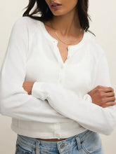 Load image into Gallery viewer, Woman wearing white cropped button-front Perfect Layer Cardigan over white tank top with light wash jeans - 4