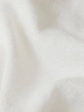 Load image into Gallery viewer, Woman wearing white cropped button-front Perfect Layer Cardigan over white tank top with light wash jeans - 2
