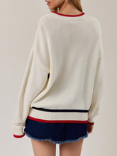 Load image into Gallery viewer, Oversized ivory knit America sweater with red and navy stripe graphic lettering, paired with denim mini skirt - 2
