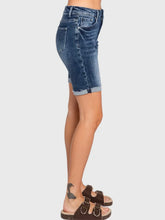 Load image into Gallery viewer, Woman wearing blue high rise bermuda denim shorts with rolled cuffs and a beige crop tee, casual summer style - 7