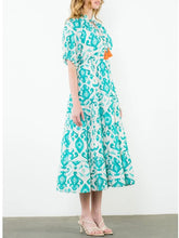 Load image into Gallery viewer, Tiered maxi dress in aqua and cream ikat print with tassel tie neckline and flutter sleeves - 3