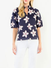 Load image into Gallery viewer, Navy floral puff sleeve top with white and red flower print, V-neck, paired with white pants - 1
