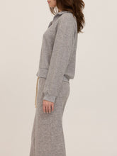Load image into Gallery viewer, Woman wearing Slow Morning Polo in Heather Grey with matching joggers, styled in desert landscape - 5
