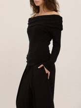 Load image into Gallery viewer, Studio City black off-shoulder long sleeve knit top with draped neckline, worn by brunette model - 3
