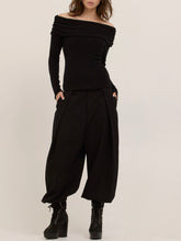 Load image into Gallery viewer, Studio City black off-shoulder long sleeve knit top with draped neckline, worn by brunette model - 5
