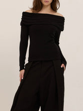 Load image into Gallery viewer, Studio City black off-shoulder long sleeve knit top with draped neckline, worn by brunette model - 4
