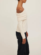 Load image into Gallery viewer, Studio City cream off-shoulder long sleeve top with folded neckline, paired with dark denim jeans, front view - 3
