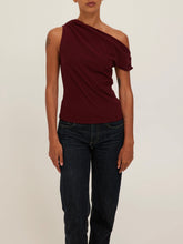 Load image into Gallery viewer, Laurel Tee in Dark Cherry, asymmetric one-shoulder draped burgundy top styled with dark wash jeans - 1
