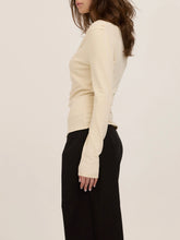 Load image into Gallery viewer, Harlow cream long sleeve top with asymmetric draped neckline and ruched waist, paired with black wide-leg trousers - 4
