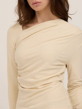 Load image into Gallery viewer, Harlow cream long sleeve top with asymmetric draped neckline and ruched waist, paired with black wide-leg trousers - 2
