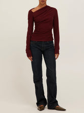 Load image into Gallery viewer, Harlow Long Sleeve Top in Dark Cherry with asymmetric draped neckline and ruched detail, worn in desert setting - 2
