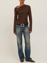Load image into Gallery viewer, Harlow Long Sleeve Top in Dark Mocha with asymmetric neckline and ruched draping, styled with low-rise jeans - 2
