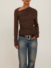 Load image into Gallery viewer, Harlow Long Sleeve Top in Dark Mocha with asymmetric neckline and ruched draping, styled with low-rise jeans - 1
