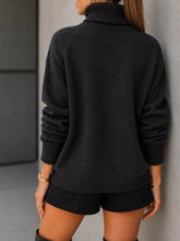 Load image into Gallery viewer, Black textured turtleneck oversized sweater with ribbed cuffs and hem, styled with black mini shorts - 2
