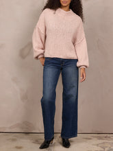 Load image into Gallery viewer, Oversized chunky knit mock neck sweater in light pink paired with wide-leg blue jeans - 7
