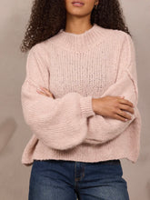 Load image into Gallery viewer, Oversized chunky knit mock neck sweater in light pink paired with wide-leg blue jeans - 4
