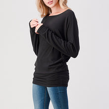 Load image into Gallery viewer, Brushed black dolman top with bateau neckline, long sleeves, and banded hem paired with blue jeans - 3
