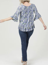 Load image into Gallery viewer, Floral Bell Sleeve Top in Blue Multi with tassel neckline and ruffle hem, paired with blue jeans - 4
