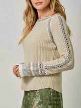 Load image into Gallery viewer, Womens almond cream knit sweater with crochet trim detail and striped cuffs paired with floral green pants - 3
