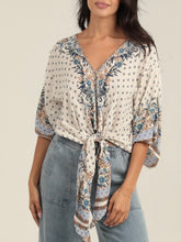 Load image into Gallery viewer, Ivory kimono sleeve tie front top with blue floral boho print, paired with light wash jeans - 5
