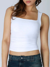 Load image into Gallery viewer, Woman wearing blue square neck shirred tank top with ruched sides paired with light wash denim skirt - 10
