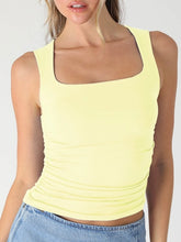 Load image into Gallery viewer, Woman wearing blue square neck shirred tank top with ruched sides paired with light wash denim skirt - 4
