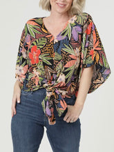 Load image into Gallery viewer, Woman wearing black multi tropical floral kimono sleeve tie front blouse with colorful leaf print and jeans - 1

