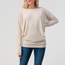 Load image into Gallery viewer, Women's oatmeal brushed dolman top with batwing sleeves and banded hem, paired with blue skinny jeans - 2
