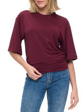 Load image into Gallery viewer, Woman wearing oversized wine burgundy ruched waist tee with half sleeves paired with blue jeans - 1
