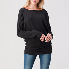 Load image into Gallery viewer, Brushed black dolman top with bateau neckline, long sleeves, and banded hem paired with blue jeans - 2
