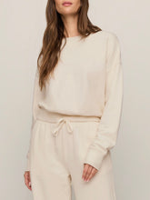Load image into Gallery viewer, Woman wearing cream oversized Clubhouse Sweatshirt in Cloud with matching drawstring sweatpants, cozy loungewear set - 1
