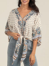 Load image into Gallery viewer, Ivory kimono sleeve tie front top with blue floral boho print, paired with light wash jeans - 1
