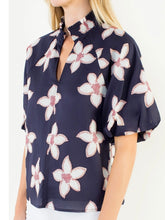 Load image into Gallery viewer, Navy floral puff sleeve top with white and red flower print, V-neck, paired with white pants - 4
