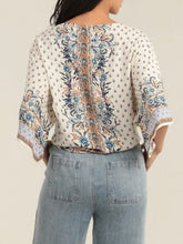 Load image into Gallery viewer, Ivory kimono sleeve tie front top with blue floral boho print, paired with light wash jeans - 3
