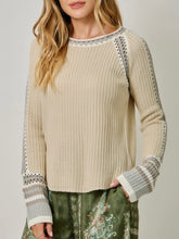 Load image into Gallery viewer, Womens almond cream knit sweater with crochet trim detail and striped cuffs paired with floral green pants - 2
