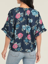 Load image into Gallery viewer, Navy floral kimono sleeve top with blue and pink roses, V-neck, tie front, and ruffle sleeves paired with jeans - 2

