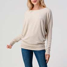 Load image into Gallery viewer, Women's oatmeal brushed dolman top with batwing sleeves and banded hem, paired with blue skinny jeans - 1
