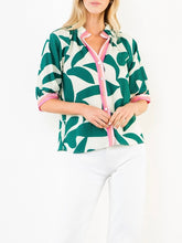 Load image into Gallery viewer, Silky Geo Top in green and white tropical leaf print with pink contrast trim, button-front, 3/4 sleeves - 1
