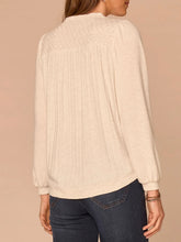 Load image into Gallery viewer, Heather cream mix media notch neck top with lace yoke, ribbed front, and balloon sleeves paired with dark jeans - 2
