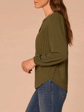 Load image into Gallery viewer, Women's olive green mix media notch neck top with ribbed front, lace yoke detail, and balloon sleeves paired with jeans - 3
