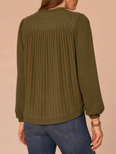Load image into Gallery viewer, Women's olive green mix media notch neck top with ribbed front, lace yoke detail, and balloon sleeves paired with jeans - 4
