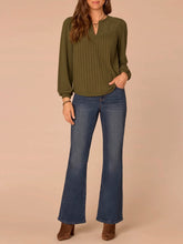 Load image into Gallery viewer, Women's olive green mix media notch neck top with ribbed front, lace yoke detail, and balloon sleeves paired with jeans - 2
